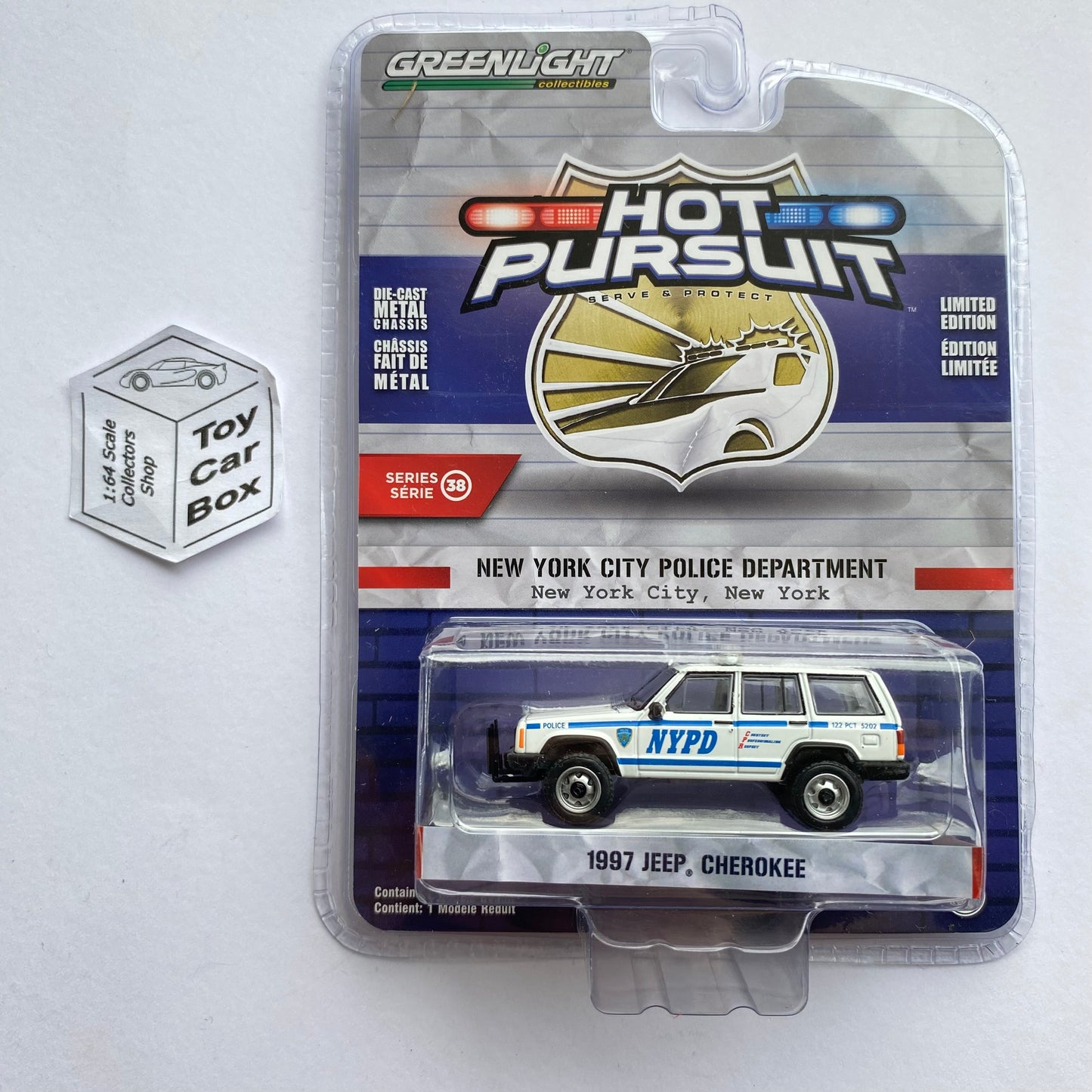 GREENLIGHT - 1997 Jeep Cherokee (White - 1:64 Hot Pursuit Series 38) J45g