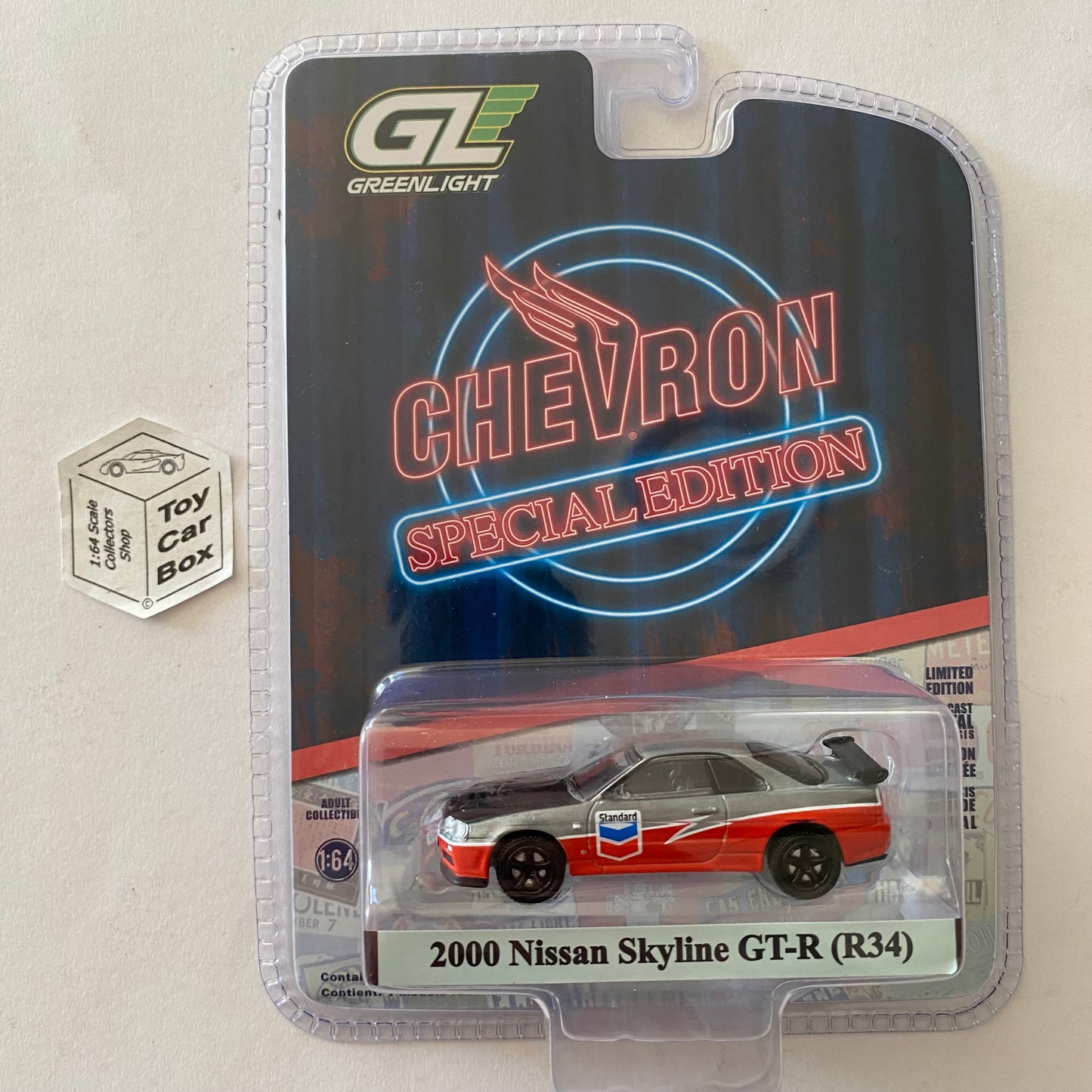 GREENLIGHT - 2000 Nissan Skyline GT-R R34 (Chevron - Chase Special Edition) J38g