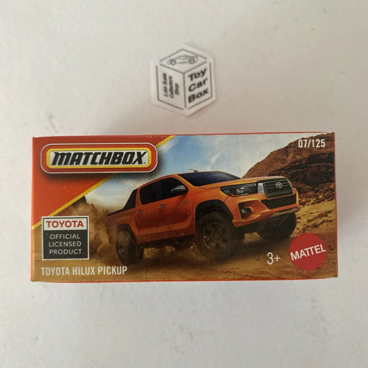 2026 MATCHBOX #7 - Toyota Hilux Pickup (Orange - Power Grab) C00