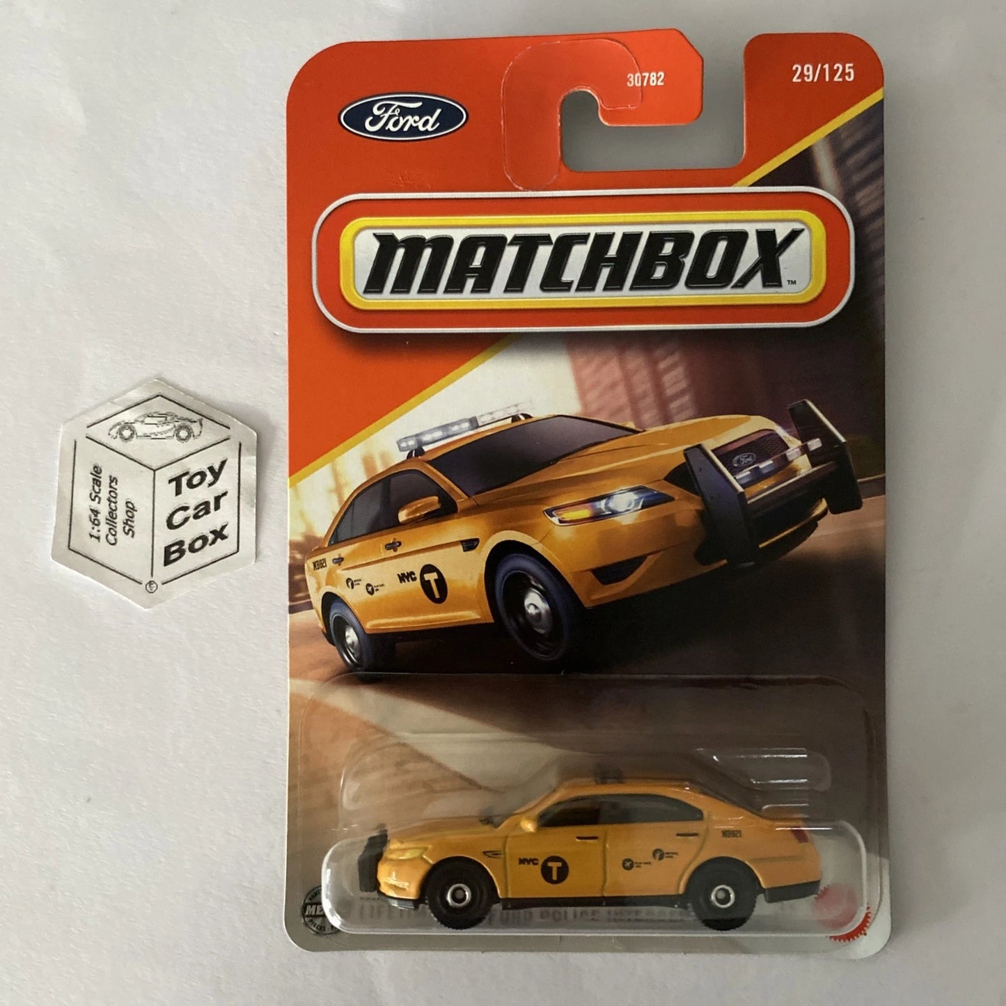 2025 MATCHBOX #29 - Ford Police Interceptor (Yellow NYC Taxi - Long Card) B64