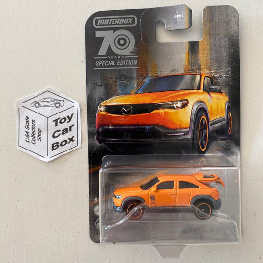 2023 MATCHBOX Moving Parts - '21 Mazda MX-30 (Orange - 70 Years Special Edition) E42g